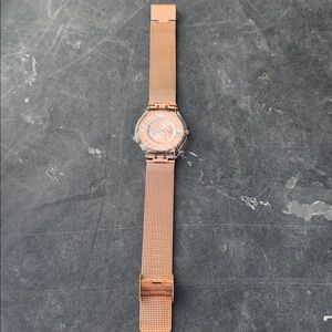 Women’s rose gold Swatch watch